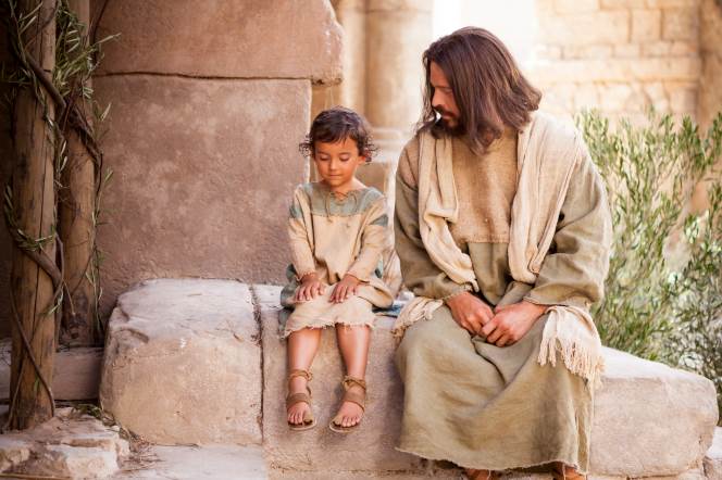 Jesus Christ sitting with a little child