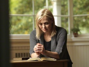 a woman is praying