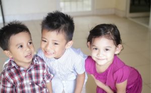 Siblings posing for a picture