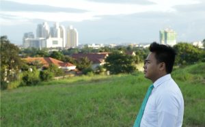 A young man pondering