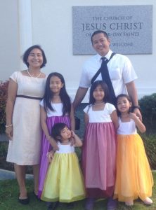 A mother with her family at church.