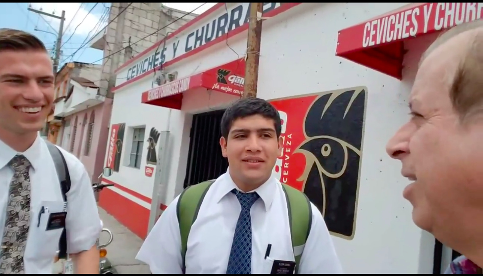 a pastor talking to mormon missionaries