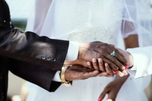 hands of father and daughter given to marriage