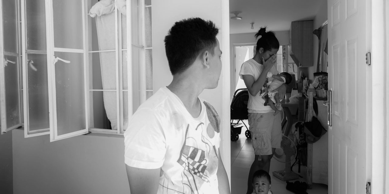 man looking back to his family