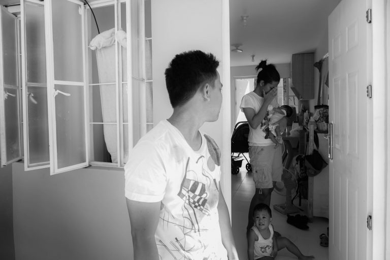 man looking back to his family