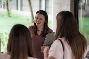 woman talking to other women