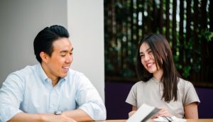 A man and a woman having a conversation.