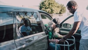 A person helping an elderly.