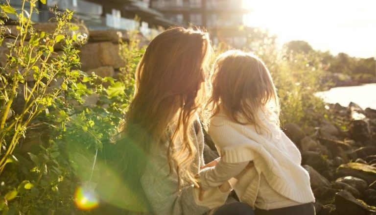 Photo of mother and daughter at the beach.