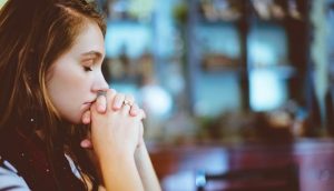 A person earnestly praying.